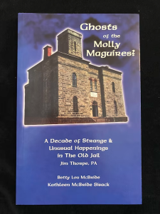 Book titled “Ghosts of the Molly Maguires?” featuring the Old Jail on a dramatic blue background.